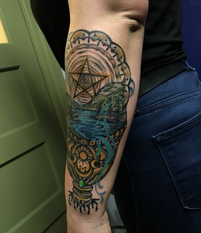 this is a tarot tattoo inspired by the queen of pentacles and king of cups done by Amanda Marie tattoo artist and tarot reader in Los Angeles California at her private tattoo studio ace of wands tattoo 
