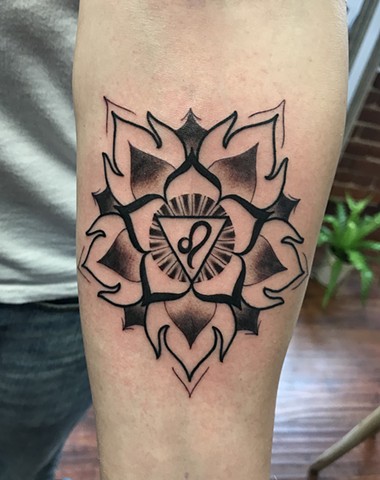 this is a mandala tattoo representing the third chakra done in black and grey by amanda marie tattooer at ace of wands tattoo in san pedro los angeles california it is a high end intimate tattoo experience 