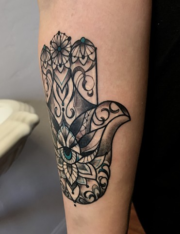 this is a hamsa protection tattoo done in a ornamental geometric style by amanda marie tattooer in san pedro palos verdes los angeles california at ace of wands intimate private high end professional tattoo studio 