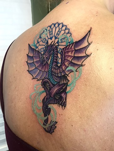 this is a spirit animal tattoo of a dragon done in color on the upper back by amanda marie tattooer at ace of wands tattoo high end intimate tattoo experience in san pedro palos verdes los angeles california 