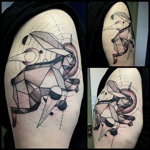 this is a tattoo of a geometric rabbit in space done in black and grey by amanda marie tattooer female vegan tattoo artist in san pedro los angeles california 