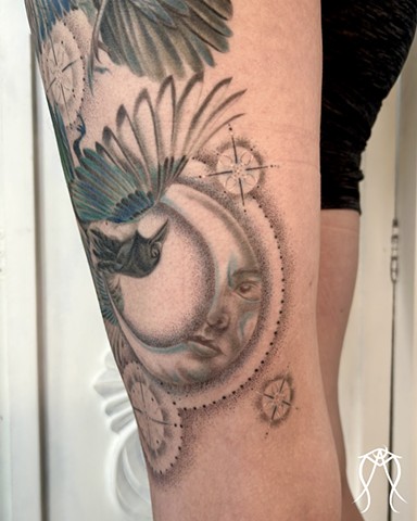 This is a color tattoo done by female tattoo artist Amanda Marie in central New York it features a crow and magpie with two moons and stars done in a fine line style of tattooing Amanda is a multidisciplinary artist and witch as well as herbalist and tarot reader and  loves creating nature based and spiritual tattoos