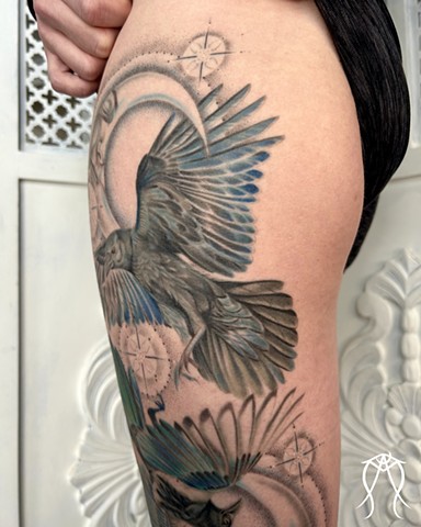 This is a color tattoo done by female tattoo artist Amanda Marie in central New York it features a crow and magpie with two moons and stars done in a fine line style of tattooing Amanda is a multidisciplinary artist and witch as well as herbalist and tarot reader and  loves creating nature based and spiritual tattoos