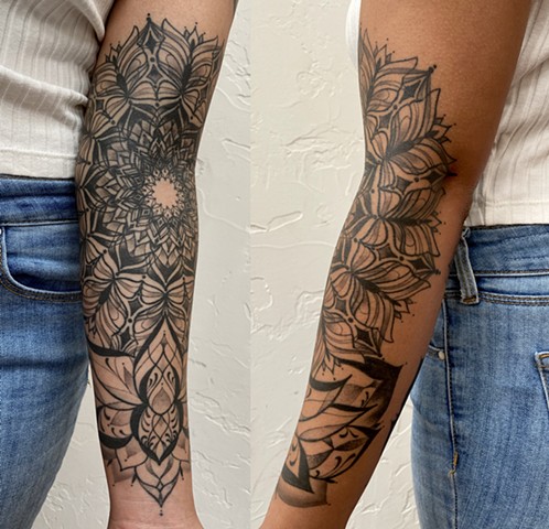 this is a ornamental ornate tattoo of a butterfly inspired mandala rising from a geometric lotus flower done by Amanda Marie Los Angeles female tattoo artist 