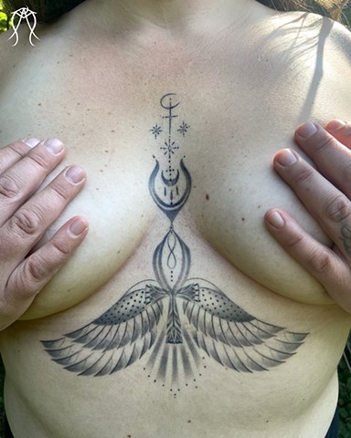 This is a goddess tattoo done by female tattoo artist and witch Amanda Marie at her private studio in central New York ace of wands tattoo it is a black and grey fine line tattoo ornate ornamental 