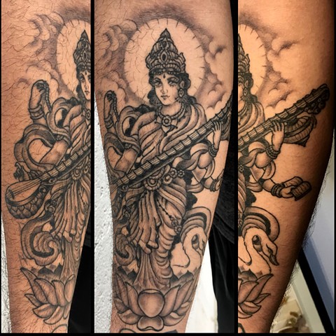 this is a tattoo of saraswati done in black and grey by amanda marie tattooer at ace of wands private tattoo studio in los angeles san pedro california 