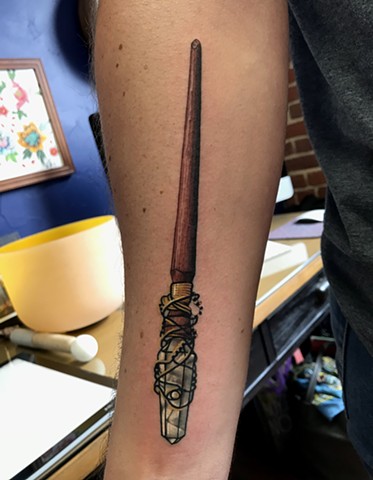 this is a tattoo of a crystal magick wand from the realm of merlin done by Amanda Marie tattooer at ace of wands tattoo in Los Angeles California San Pedro. this tattoo embodies magick and is a reminder that the magick comes from within you always believe