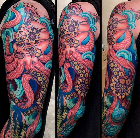This is a geometric inspired octopus tattoo done by Amanda Marie owner of private tattoo studio ace of wands in San Pedro California Los Angeles color tattoo mandala 