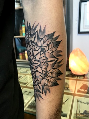 this is a tattoo of a mandala flower done in black and grey by Amanda Marie tattoo artist and owner of ace of wands tattoo in Los Angeles San Pedro California sacred private tattoo space and studio for magick and conceptual tattoos 