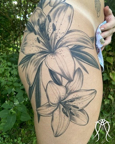 This is a large flower floral tattoo done in black and grey by Amanda Marie female tattoo artist in central New York at ace of wands tattoo 