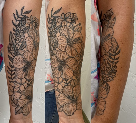 this is a tropical ornamental flower floral tattoo done in a etching black and grey style by Amanda Marie female tattoo artist and tarot reader at her private studio in Los Angeles California