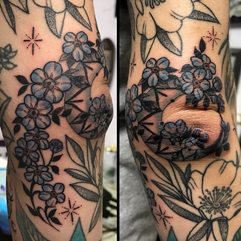 this is a tattoo of moon flowers and stars done in a delicate ornamental style illustrative by amanda marie tattooer female tattoo artist in los angeles san pedro california tattooing at ace of wands tattoo sacred spiritual space 