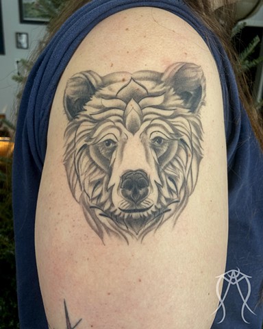 This is a fine line nature tattoo of a bear done in black and grey fully healed by female tattoo artist and witch Amanda Marie in her private studio in central New York ace of wands tattoo 