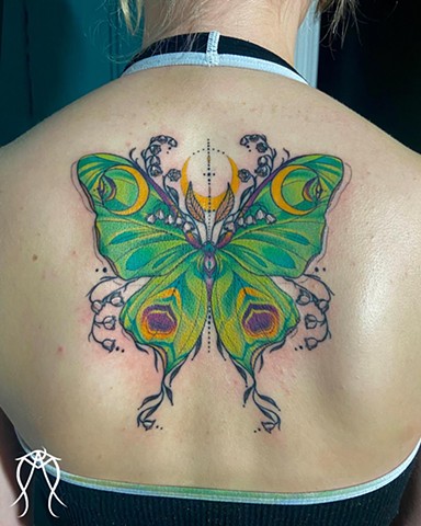 This is a sacred magick color tattoo of a Luna goddess moth done by female tattoo artist and tarot reader Amanda Marie at her private tattoo and tarot studio in Ithaca Scipio center New York east coast nature floral ornamental tattoos delicate