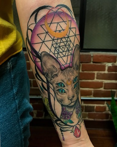 this is a tattoo of a sphinx cat representation of the high priestess tarot card embodying intuition, magick, divinity, manifestation, spirituality, and sacred wisdom done by Amanda Marie female tattoo artist and tarot reader in Los Angeles California at 