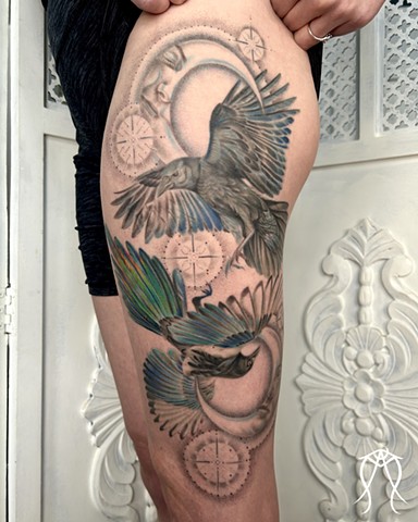 This is a color tattoo done by female tattoo artist Amanda Marie in central New York it features a crow and magpie with two moons and stars done in a fine line style of tattooing Amanda is a multidisciplinary artist and witch as well as herbalist and tarot reader and  loves creating nature based and spiritual tattoos 