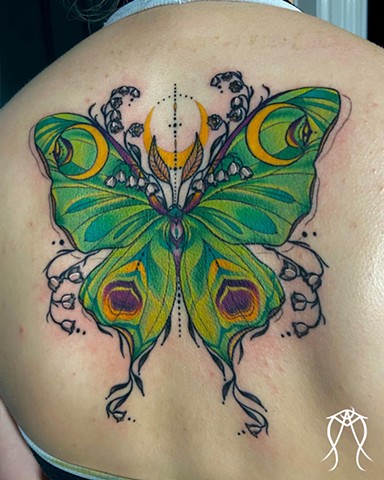 This is a sacred magick color tattoo of a Luna goddess moth done by female tattoo artist and tarot reader Amanda Marie at her private tattoo and tarot studio in Ithaca Scipio center New York east coast nature floral ornamental tattoos delicate