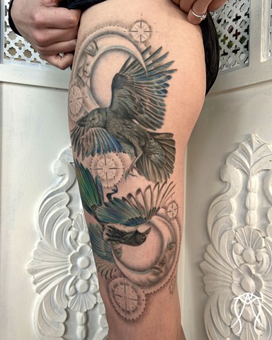 This is a color tattoo done by female tattoo artist Amanda Marie in central New York it features a crow and magpie with two moons and stars done in a fine line style of tattooing Amanda is a multidisciplinary artist and witch as well as herbalist and tarot reader and  loves creating nature based and spiritual tattoos