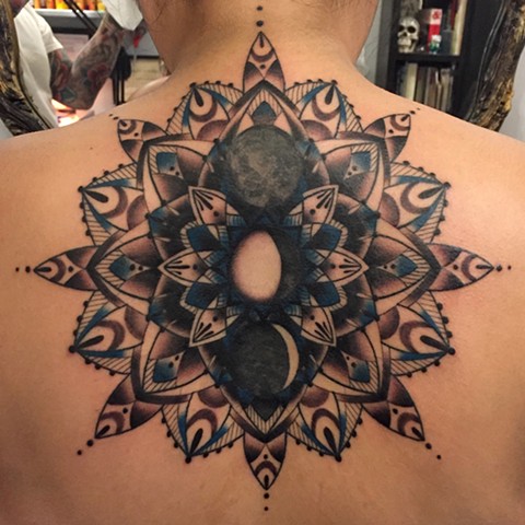 this is a mandala geometric tattoo inspired by the moon done by amanda marie tattooer at evermore tattoo in los angeles california 
