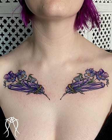 This is a color chest tattoo of birth crystals and flowers done by Amanda Marie female tattoo artist and tarot reader in her private tattoo and tarot studio in Scipio center New York east coast sacred and spiritual floral nature pagan ornamental tattoo 