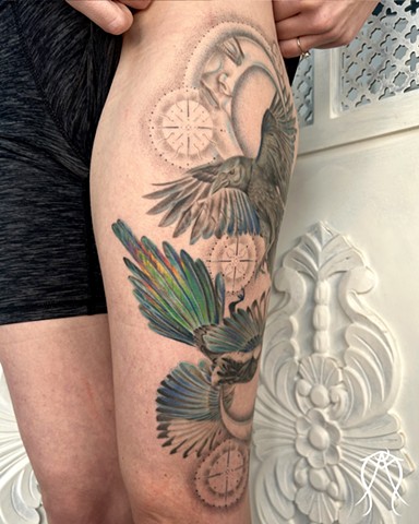 This is a color tattoo done by female tattoo artist Amanda Marie in central New York it features a crow and magpie with two moons and stars done in a fine line style of tattooing Amanda is a multidisciplinary artist and witch as well as herbalist and tarot reader and  loves creating nature based and spiritual tattoos