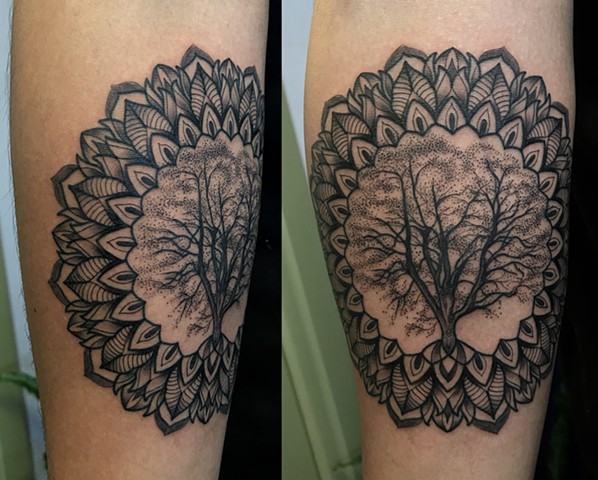 this is a mandala geometric tree of life tattoo done in a black work style by Amanda Marie female tattoo artist and tarot reader in los angles California