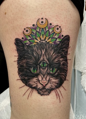 this is a tattoo of a magical mystic cat that came to met client in a dream including a mandala created by Amanda Marie Female tattoo artist and tarot reader in Los Angeles California in her private studio ace of wands tattoo