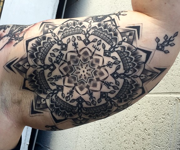 this is a mandala inspired by norse mythology done in black and grey by amanda marie lady tattooer in los angeles california at her private studio ace of wands in san pedro 