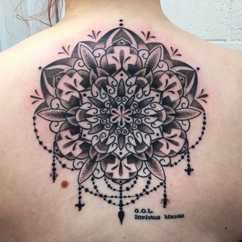 this is a dot work mandala geometric tattoo done by amanda marie at evermore tattoo in los angeles california 