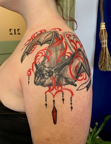 This is a bat spirit animal tattoo done by Amanda Marie at her private studio ace of wands tattoo in Los Angeles California it is mystical and inspired by art nouveau
