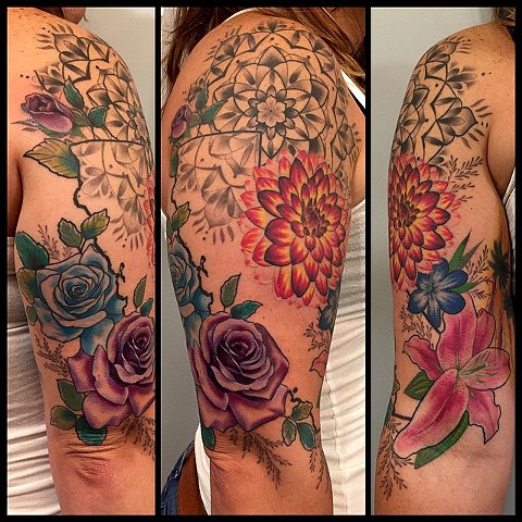 this is a california tribute tattoo including flowers and a mandala it is a half sleeve done by amanda marie at evermore tattoo in los angeles california 
