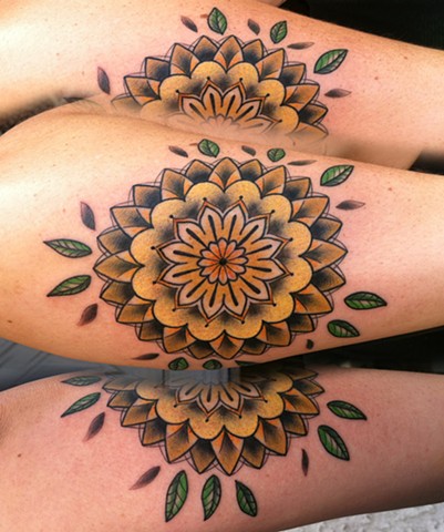 this is a tattoo of a mandala inspired by a sunflower tattooed by amanda marie at evermore tattoo in los angeles california 