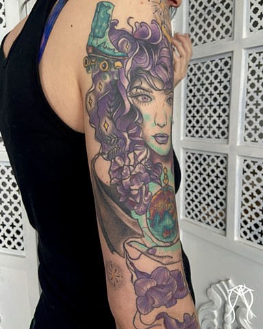 This is a sleeve tattoo  neo-traditional inspired by a literary character named witch baby done in color by female tattoo artist Amanda Marie in her private studio in central New York 