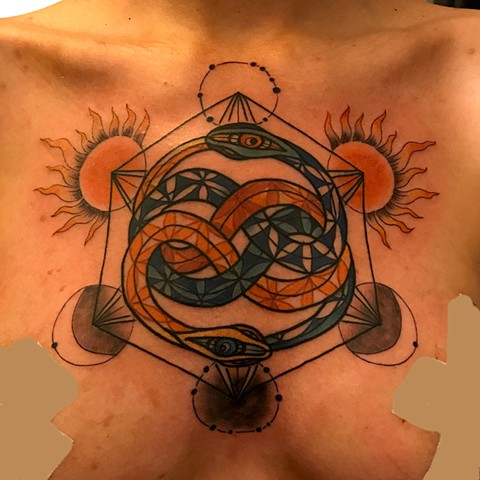 this is a auryn chest tattoo that is mystical and done in color using sacred geometry by amanda marie tattooer at ace of wands tattoo in san pedro los angeles calfirornia it is a private intimate tattoo studio that is a sacred space 