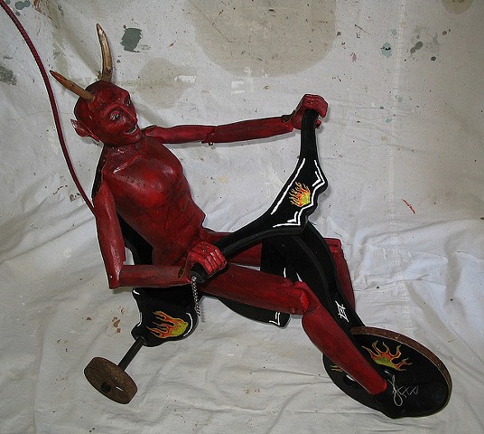 kinetic art push toy devil sculpture carving moving tricycle