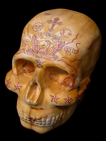 skull carving sculpture by Tim Pewe illustrated by Mark Arminski