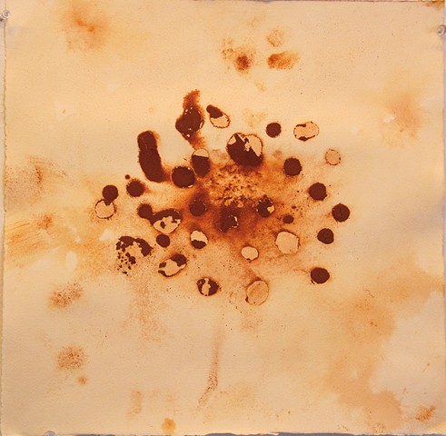 Drops of the loose clay paste make an abstract image suggesting growth and regeneration.