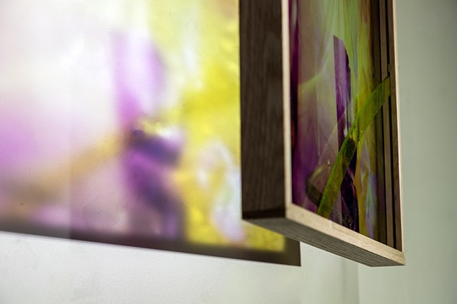 Natalie Hunter %Piecing Light, Mirror Window 01% 2025-2026 UV print on glass from 120mm negative, oak, varnish, hand cut and inlayed glass, light. 16" x 20" x 2". Suspended photo-based sculpture.