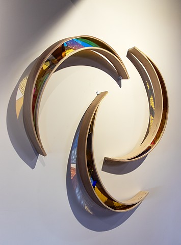 Natalie Hunter Phase Shift, Shades of Dawn Arcs 01, 02, 03 2022 | 2026 Hand shaped and curved birch, hand cut and mounted glass, colour film, light. 3 wall mounted sculptures