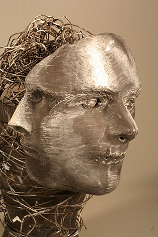 A Mask made of Paper Towel, Wood Glue, Wire, Chalkboard paint, Wire and Glass