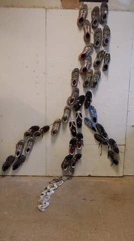 Art sculpture installation found objects fifty shoes collect personal closet shape nerve of the foot injury by Jenna Knoblach