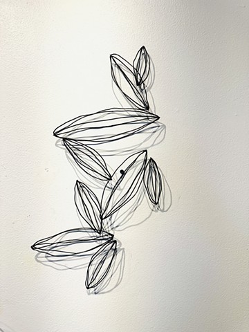 Painted black steel wire seed pod leaf modern sculptures abstract shadows