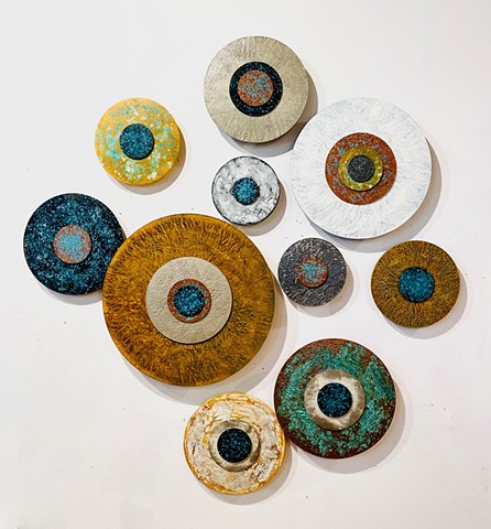 Circular paintings with copper patina rust and metallic finishes modern yet rustic