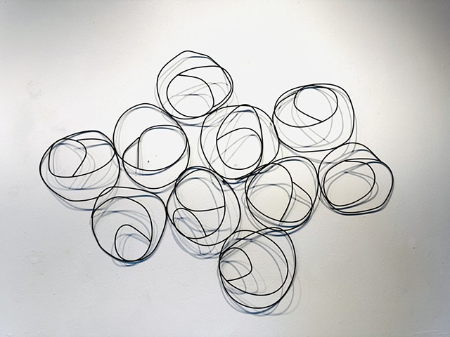 Steel wire wall sculpture rock formations contemporary metal wall art shadows and light