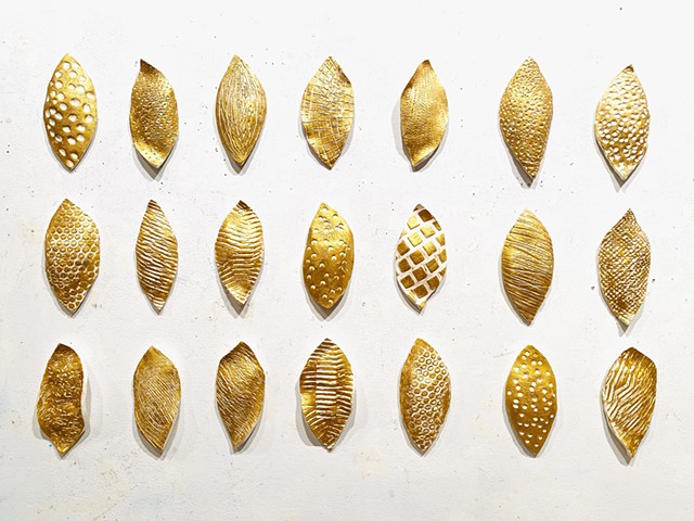 Ceramic gold seeds contemporary wall sculpture installation stoneware metallic paint encaustic