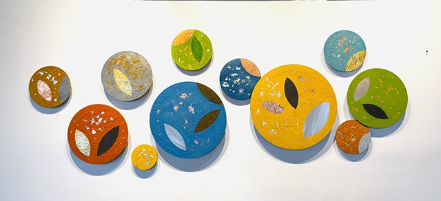 Spring colorful aluminum mixed-media wall sculpture seeds and leaves metallic circle art installation