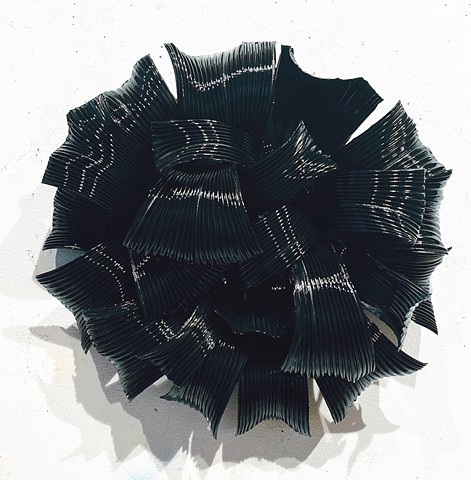 Circular modern contemporary abstract organic black wall art sculpture
