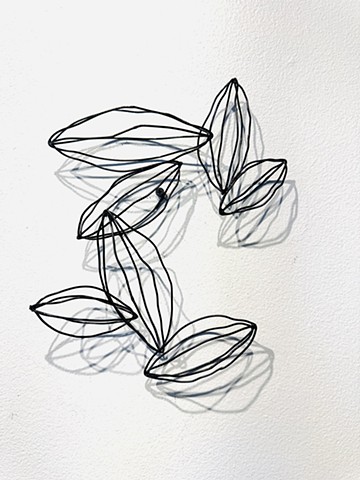 Black steel wire wall sculpture with deep shadows abstract modern