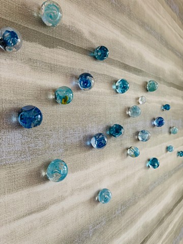 Hand-blown glass orbs blue water art installation solid blue clear glass circles raindrops water droplets