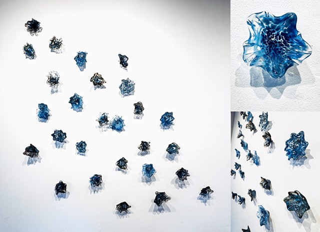 Hand-blown glass blue organic flower space nebula wall art installation contemporary shadows and depth